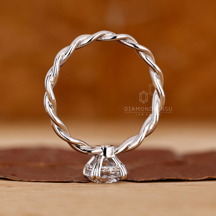 Designer hidden halo round diamond engagement ring.