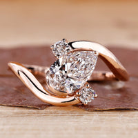 Three stone diamond ring in rose gold.