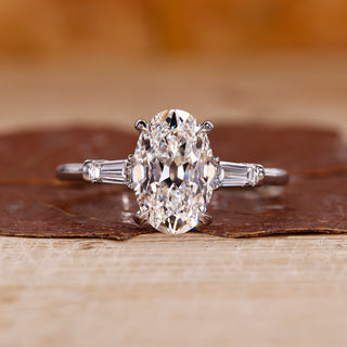 3 stone diamond engagement ring with oval old European cut ring.