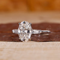 Oval old European cut ring and tapered baguette side stone.