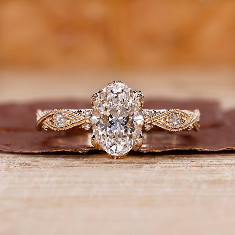 Oval shaped engagement ring with art deco ring.