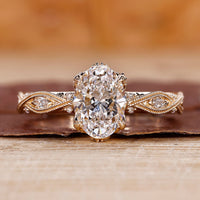 Oval shaped engagement ring with art deco ring.