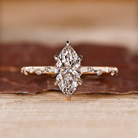 Round Cut Diamond Ring with flush pave setting in yellow gold.