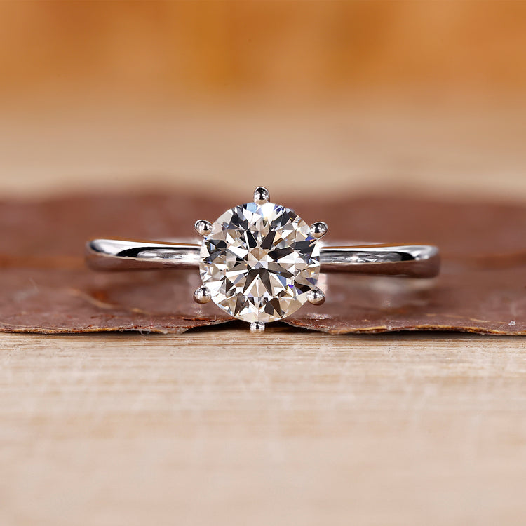Solitaire engagement ring and round cut diamond ring.