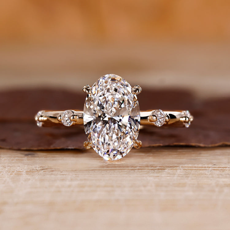 Oval Diamond Engagement Ring with round side stones and hidden halo.