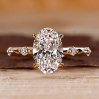 Oval Diamond Engagement Ring with round side stones and hidden halo.