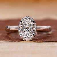 Halo diamond engagement ring and oval cut diamond ring.