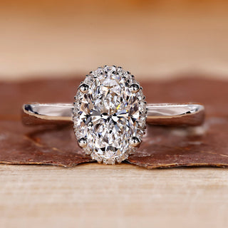Halo diamond engagement ring and oval cut diamond ring.
