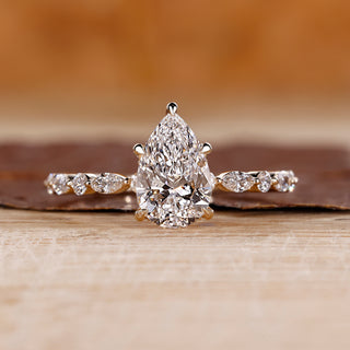 Pear shaped engagement ring with hidden halo.