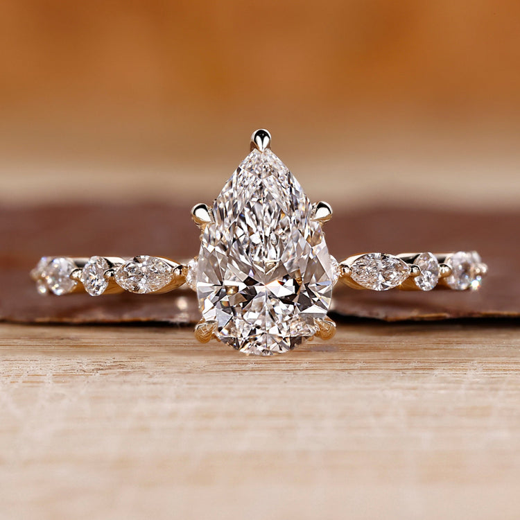 Pear shaped engagement ring with hidden halo.