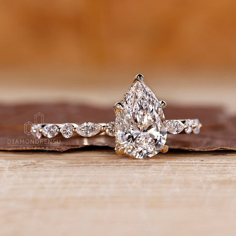 Shared prong setting ring in yellow gold.