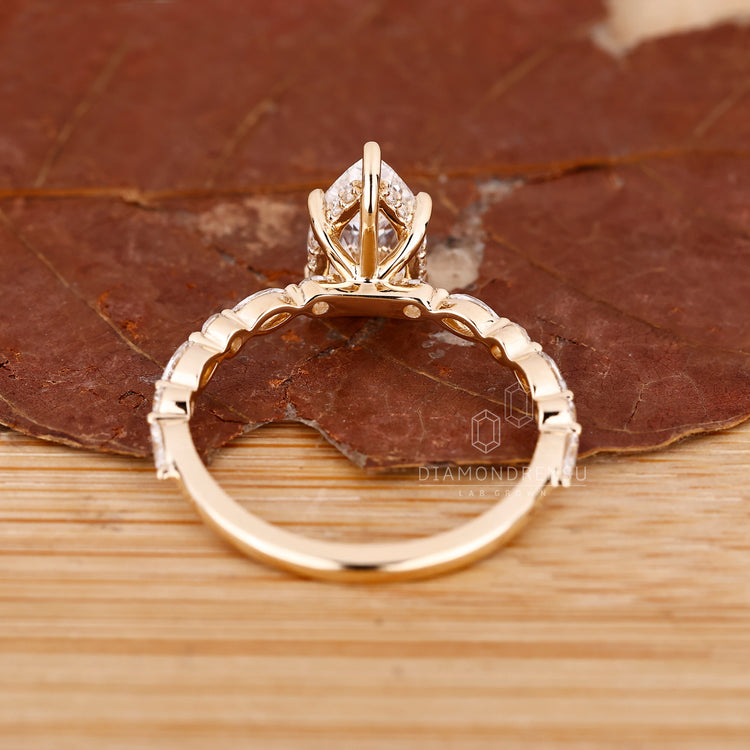 Lab grown pear shaped engagement ring design.