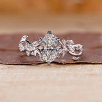 Oval diamond engagement ring with vine engagement ring.