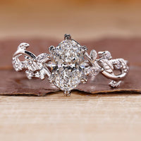 Oval diamond engagement ring with vine engagement ring.
