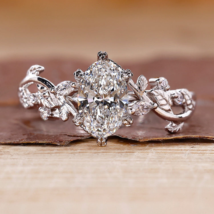 Oval diamond engagement ring with vine engagement ring.