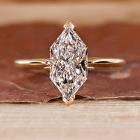 Hidden halo engagement ring with Dutch marquise ring.