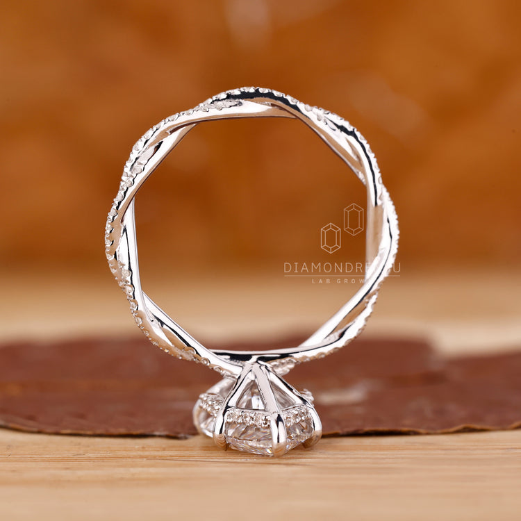 Hidden Halo Engagement Ring with marquise and round diamonds.
