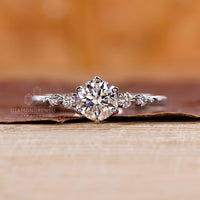 Handmade 5 diamond ring with tapered shank in white gold.