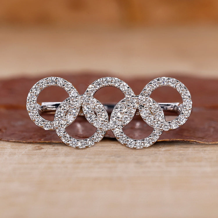 Round diamond engagement ring with Diamond Olympic Ring.