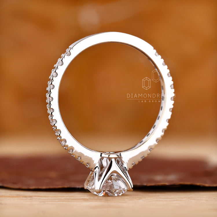 Unique round cut pave diamond ring style.