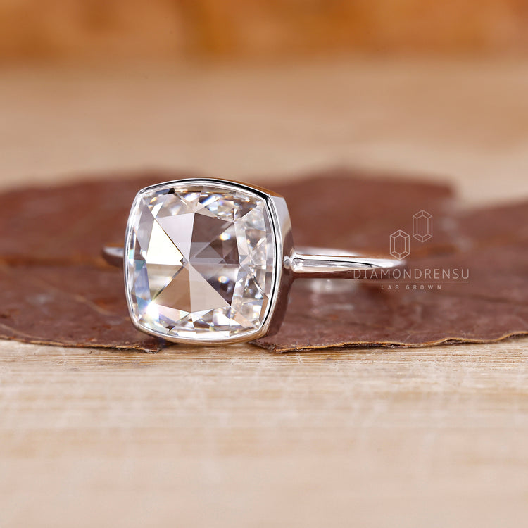 Bezel set diamond ring matches white gold engagement ring.