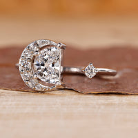 Half moon cut engagement ring with open gap ring.