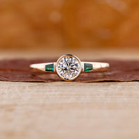 Bezel set engagement ring with round diamond engagement ring.