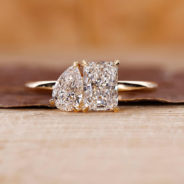 Toi et moi engagement ring with pear and radiant diamond ring.