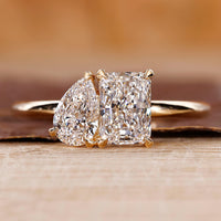 Toi et moi engagement ring with pear and radiant diamond ring.