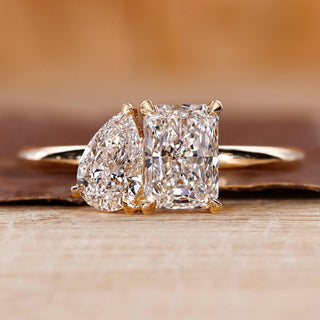 Toi et moi engagement ring with pear and radiant diamond ring.