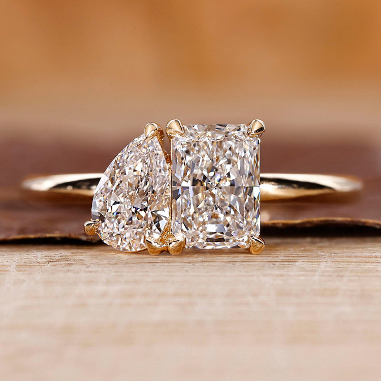 Toi et moi engagement ring with pear and radiant diamond ring.