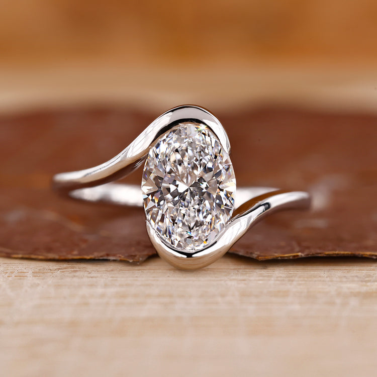 Oval cut diamond ring with bypass setting.