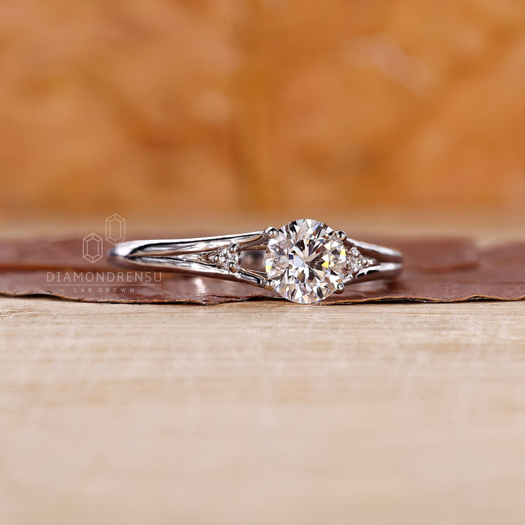 Handmade split shank ring with 4 prong round diamond setting.