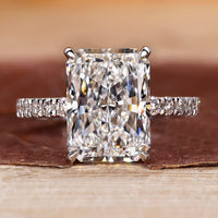Radiant cut engagement ring with pave setting.