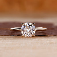 Round old European cut ring solitaire four prong style.