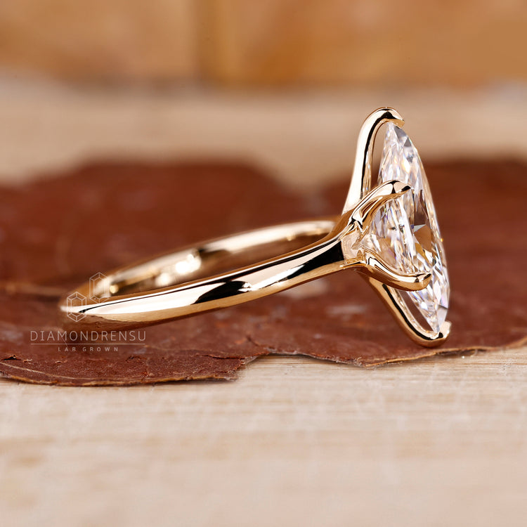Handmade yellow gold ring with lab grown diamond solitaire.