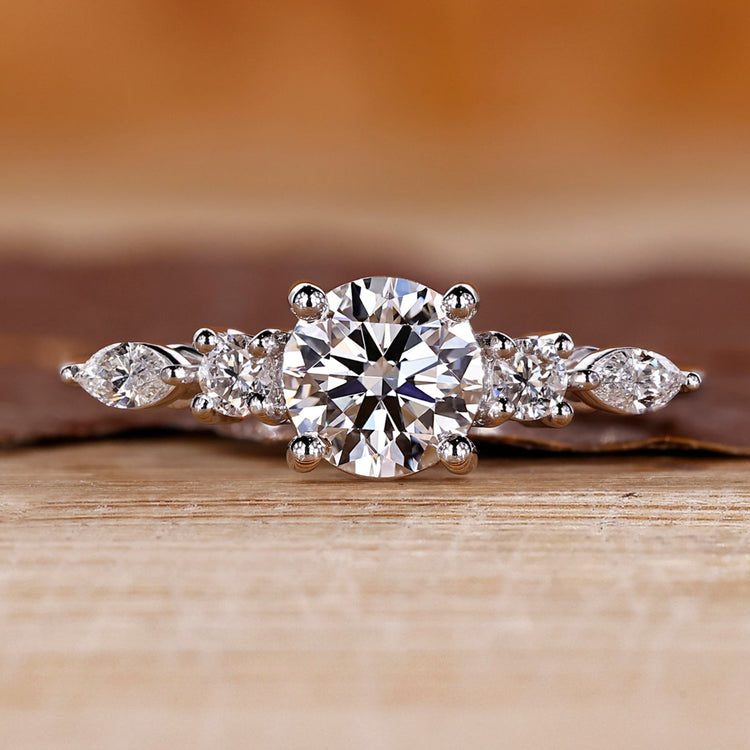 Round and Marquise Diamond Ring with tapered shank band.