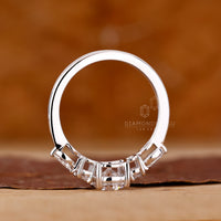 4 Claw Prong Ring holding marquise and round diamonds.