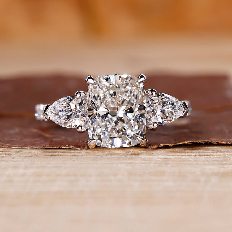 Cushion cut engagement ring with pave setting ring.