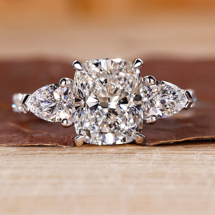 Cushion cut engagement ring with pave setting ring.
