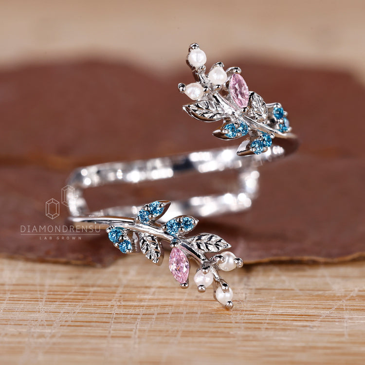 Open gap wedding band with gemstones.