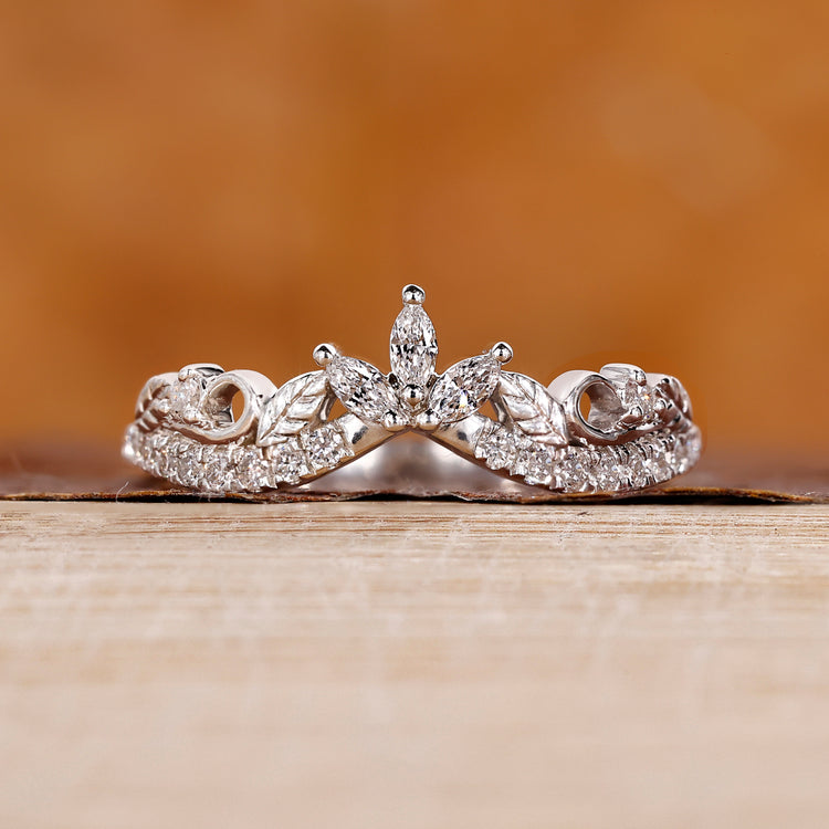 Marquise and round wedding band with white gold band.