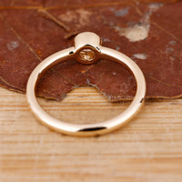Yellow gold solitaire ring with round cut diamond centre.