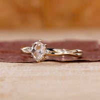 Oval rose cut engagement ring with 3 stone diamond ring.