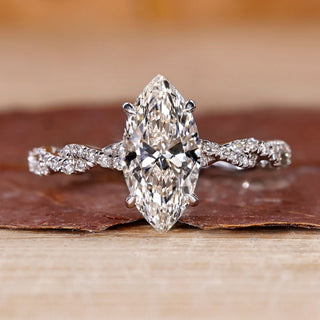 Hidden halo marquise diamond engagement ring in white gold.