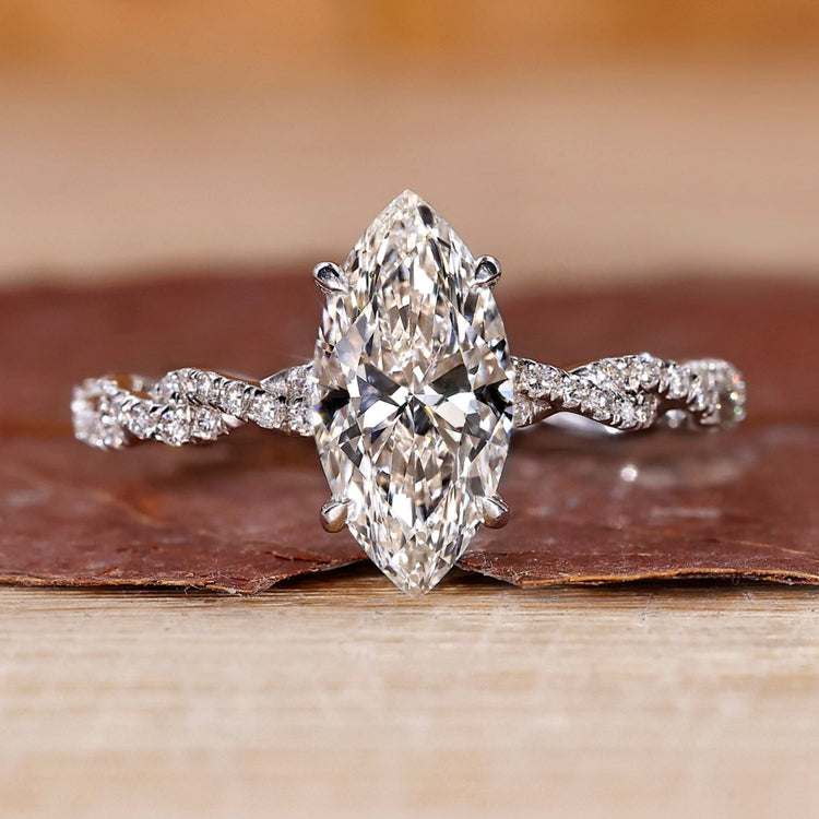 Hidden halo marquise diamond engagement ring in white gold.