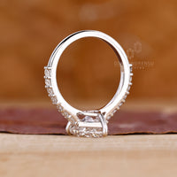 Custom white gold ring with pear diamond and prong setting.