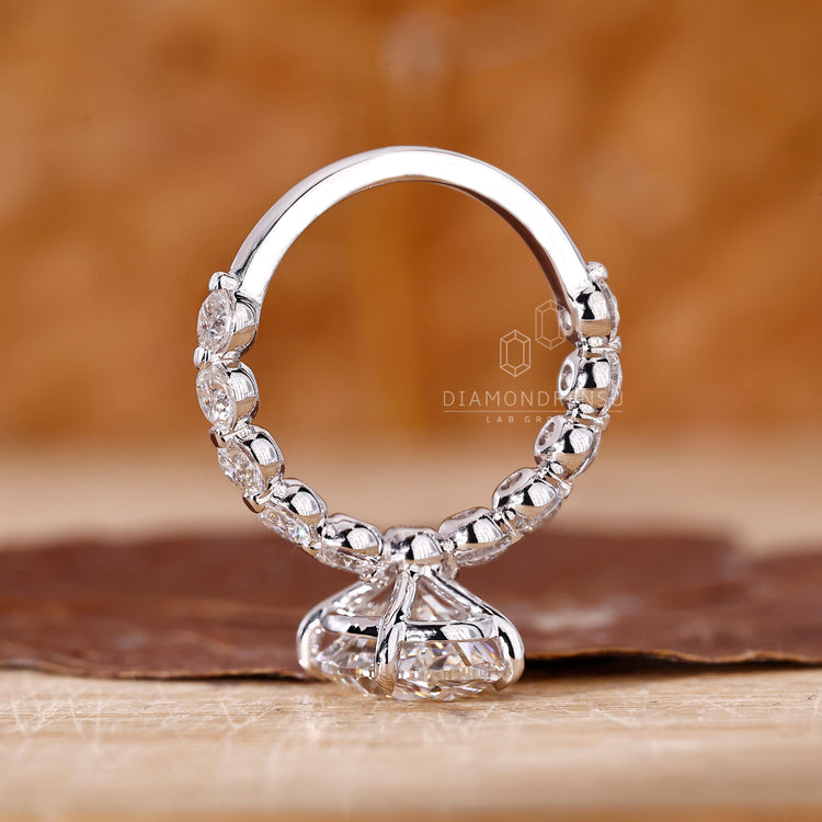 Buy Engagement ring with round side stones.