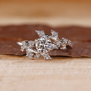 Cluster diamond ring with round cut stones.