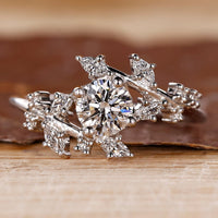 Cluster diamond ring with round cut stones.